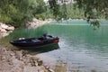 Wonderful panorama of the lake of Scanno with a blue boat.