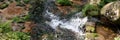 Wonderful panoramic landscape with moss and stones in the mountain river. Natural background