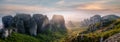 Wonderful Panoramic view of Meteora. Majestic sunny landscape with colorful sky over the fairytale mountain valley in Greece.