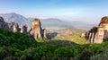 Wonderful Panoramic view of Meteora. Majestic sunny landscape with colorful sky over the fairytale mountain valley in