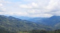 Wonderful picturesque landscape of majestic green mountains under the heavy clouds