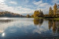 Wonderful picturesque Scene. Awesome Autumn landscape with colorful sky, reflected on the calm river. Amazing nature counryside. I