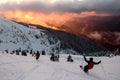 Wonderful picturesque scene of mountain landscape and freeride skiers descends from slope Royalty Free Stock Photo