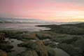 Wonderful purple sunset over the sea. Fakrutny stone shore in the foreground. Arctic Ocean Royalty Free Stock Photo