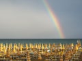 Wonderful rainbow over the Adriatic sea. Contrast between the bright colors of the rainbow and the green sea