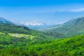 Wonderful romantic summer afternoon landscape panorama. Green, emerald valley of in the canyon plateau. Deciduous forest. Baska on