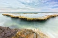 Wonderful seascape with sea waves hitting large rock Royalty Free Stock Photo