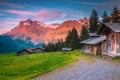 Wonderful summer alpine location with wooden huts and mountains, Switzerland Royalty Free Stock Photo