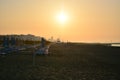 The sky turns orange on the beach in front of the sea Royalty Free Stock Photo