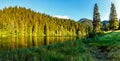 Wonderful summer morning. majestic mountain lake in mountain. Lakul Rosu - Red Lake or Lake Killer. The location of Europe. Easter