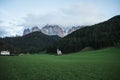 Sunny Landscape of Dolomite Alps with St Johann Church and mountains in the background Royalty Free Stock Photo