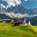 Wonderful Sunny Landscape of Dolomite Alps. St Johann Church, Santa Maddalena, Val Di Funes, Dolomites, Italy. Fairy velley in Royalty Free Stock Photo