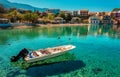 Wonderful Sunny seascape of Asos village, Kefalonia Island. Greece. Sunny spring seascape. boat in azure clear Water of Royalty Free Stock Photo