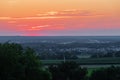 A wonderful sunset with a few fluffy clouds, covering the rolling hills in Bemelen in south Limburg in the Netherlands Royalty Free Stock Photo