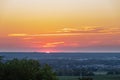 A wonderful sunset with a few fluffy clouds, covering the rolling hills in Bemelen in south Limburg in the Netherlands Royalty Free Stock Photo