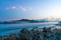 Wonderful sunset landscape on the seashore, colors of the sunset sky and silhouette of island in the water. incredible tropical