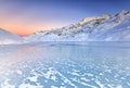 a wonderful sunset over the frozen lake from the intense cold of the night Royalty Free Stock Photo