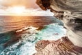 Wonderful sunset over the sea with waves. Amazing view from the rocky coast at Bondi Beach in Sydney Australia. Royalty Free Stock Photo