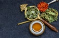 Wonderful Thai herbal tea with Dried pandan herb, indian marsh fleabane and safflower with honey on spoons Royalty Free Stock Photo
