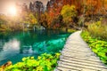 Wonderful tourist pathway in colorful autumn forest, Plitvice lakes, Croatia Royalty Free Stock Photo