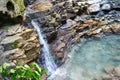 Wonderful tranquil waterfall of mountain brook falling from the rocks
