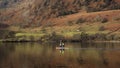 Wonderful unusual Winter landscape views of mountain ranges around Ullswater in Lake District viewed from boat on lake with Royalty Free Stock Photo