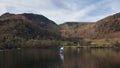 Wonderful unusual Winter landscape views of mountain ranges around Ullswater in Lake District viewed from boat on lake with Royalty Free Stock Photo