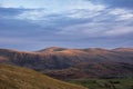 Wonderful vibrant sunset landscape image of view from Latrigg Fell towards Great Dodd and Stybarrow Dodd in Lake District