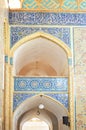 A wonderful view of beautiful Iranian decorations on the tiles of the walls of the Yazd Grand Mosque. Yazd, Iran.