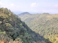 Wonderful view of big fluffy cloud over top of mountain. Royalty Free Stock Photo