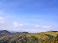 Wonderful view of big fluffy cloud over top of mountain.