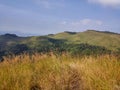 Wonderful view of big fluffy cloud over top of mountain. Royalty Free Stock Photo