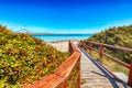 Wonderful view of Famous La Pelosa beach Spiaggia della Pelosa with wooden footbridge Royalty Free Stock Photo