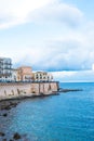 Wonderful view of the seafront of Ortigia in Syracuse on a summer day, with blue sea and cloudy sky as a backdrop