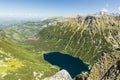 A wonderful view of the valley with the Sea Eye Morskie Oko lake and the surrounding mountains from the Monk Mnich peak in the