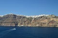 Wonderful Views Of The City Of Fira On Top Of A Mountain On The Island Of Santorini From High Seas With A Boat Transporting Passen