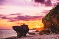 Wonderful warm sunset, rocks, sand beach and ocean in Bali