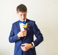 Wonderful wedding boutonniere on a costume of groom