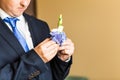 Wonderful wedding boutonniere on a costume of groom close-up