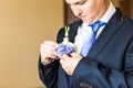 Wonderful wedding boutonniere on a costume of groom close-up