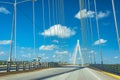 Wonderful white bridge structure over clear blue sky. Mauricio Baez Bridge, a cable-stayed bridge near San Pedro de