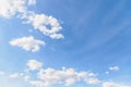 Beautiful white few soft fluffy clouds on a blue sky background. Copy space Royalty Free Stock Photo