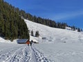 Wonderful winter hiking trails and traces on the fresh alpine snow cover of the Alpstein mountain massif and in the Obertoggenburg