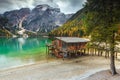 Wonderful wooden boathouse on the alpine lake, Dolomites, Italy, Europe