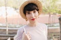 Wonderful young woman with big green eyes looking to camera with gently smile. Portrait of amazing brunette lady wearing Royalty Free Stock Photo