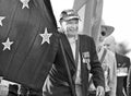 Old Australian Navy veteran leads Anzac Day parade flag bearer Royalty Free Stock Photo