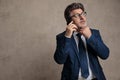 Wondering businessman talking on his mobile Royalty Free Stock Photo