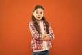 Wondering every day. Upbringing versatile personality. Childhood concept. Girl child stand orange background. Mentally