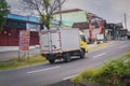 Mitsubishi canter box truck driving fast on the road
