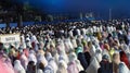 Eid al-Fitr prayer performed by Indonesian Muslims in a field
